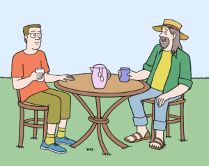 Zwei Personen sitzen an einem Tisch im Garten und trinken Tee. Sie tragen Sommer-Kleidung